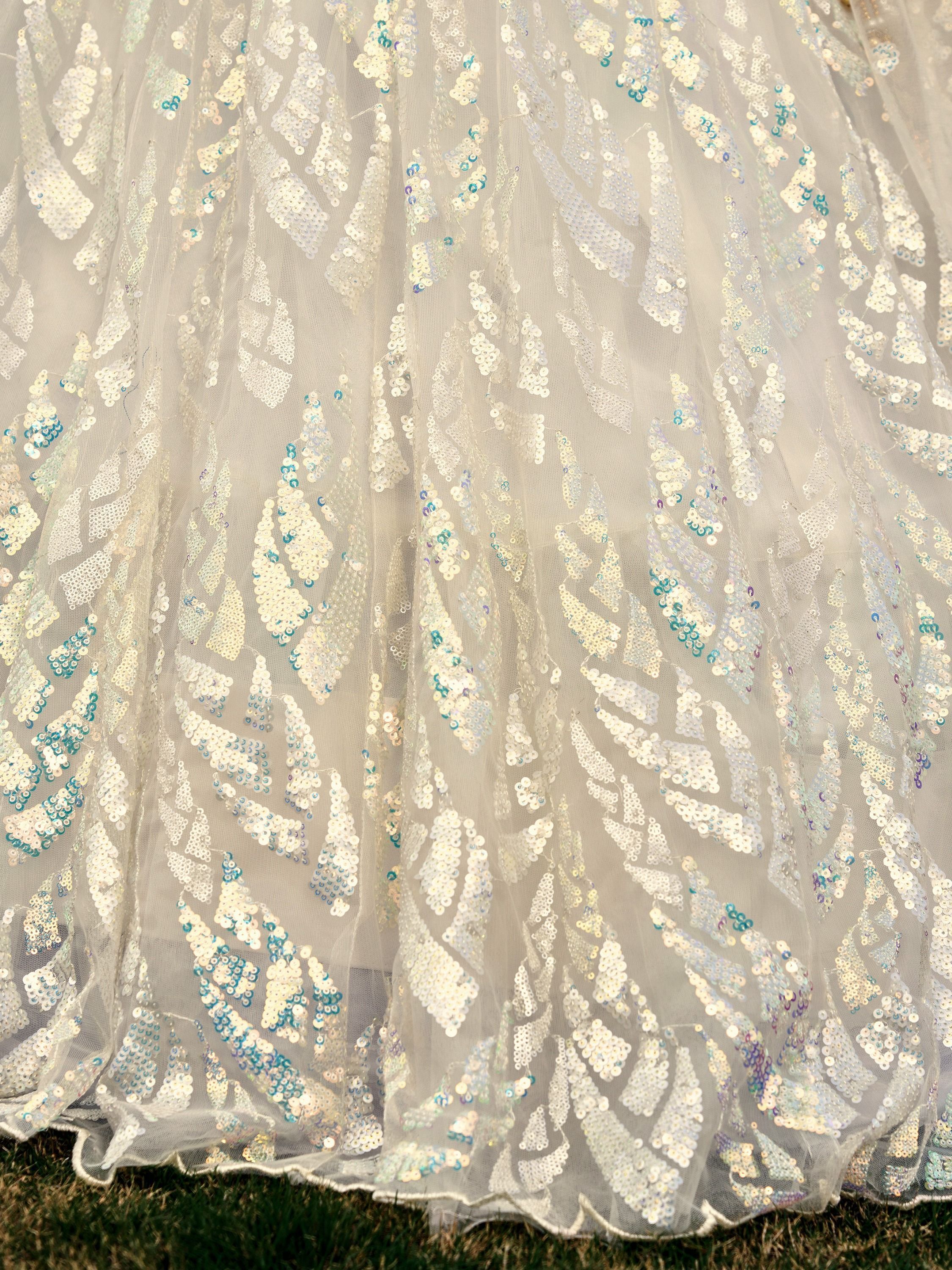 Off White soft net lehenga choli with heavy multi sequins embroidery and lace border dupatta perfect for weddings receptions and glam parties